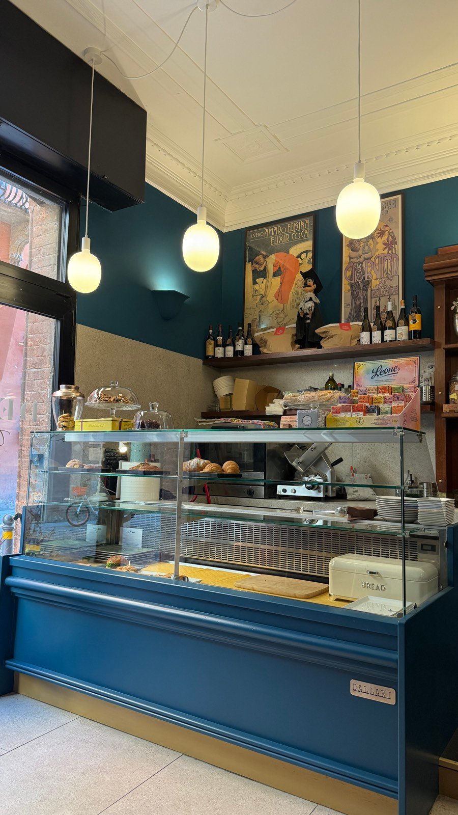 The blue-toned interior of Denso coffee bar in Bologna