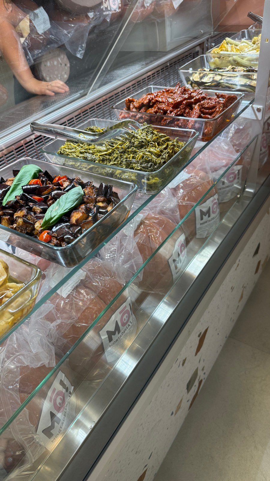 The mortadella and deli counter at Mo Mortadella Lab near Bologna station