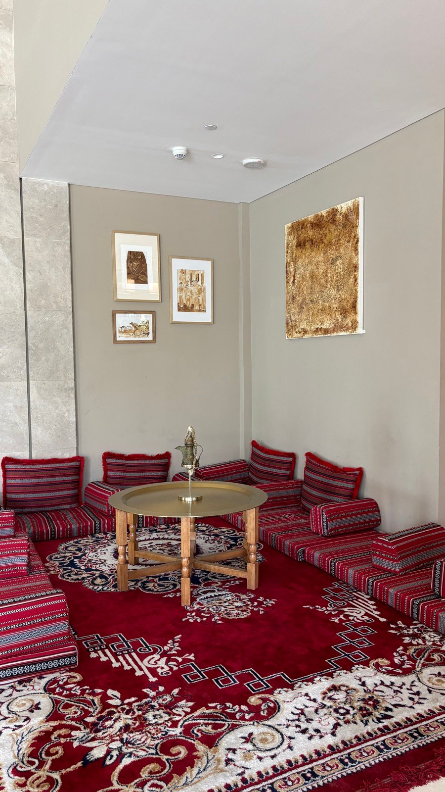 Lobby area at dusitD2 Naseem Resort with carved wood and Omani fabrics