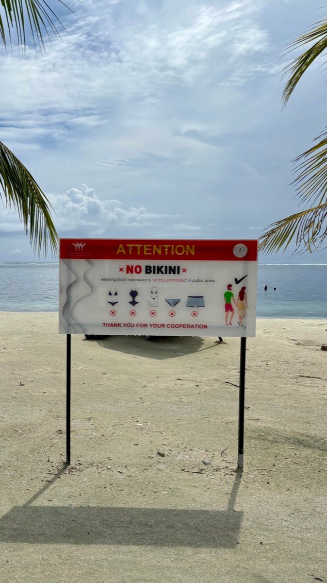 An Attention No Bikini sign on the non-bikini beach on Maafushi