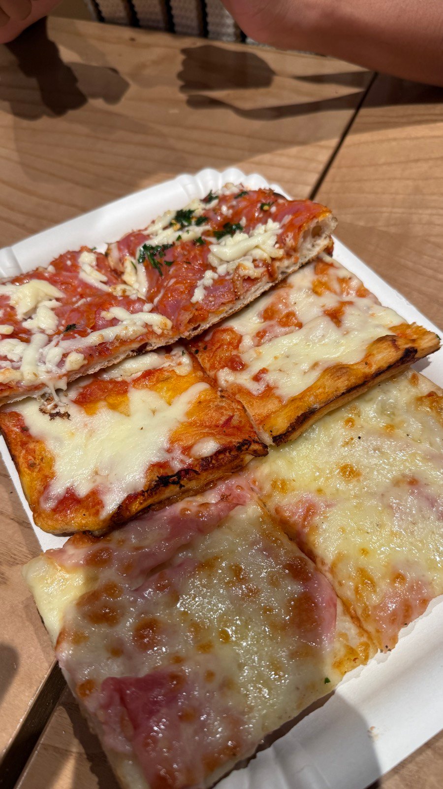 Pizza al taglio by weight at Alice Pizza in Trastevere, Rome