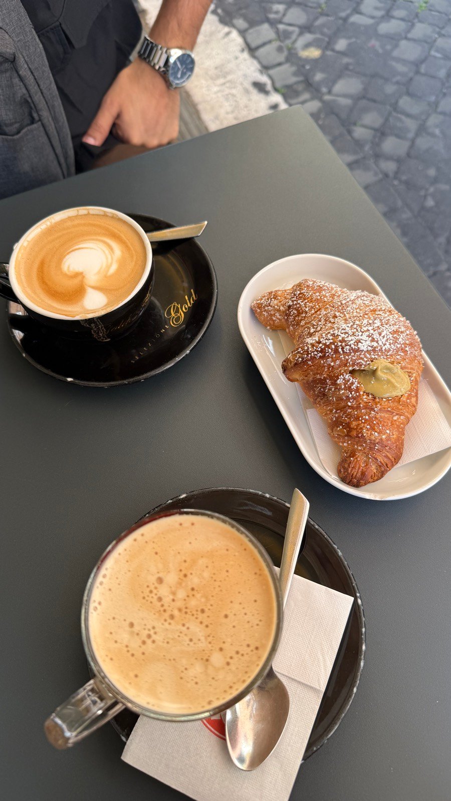 An espresso and pastry at a small coffee bar in Rome
