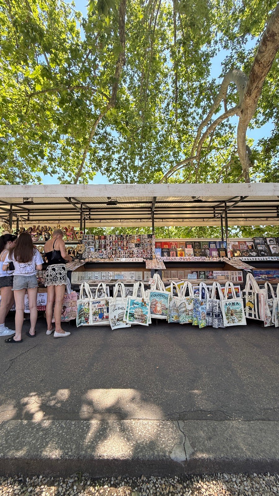 Souvenir and food shops on a street near the Vatican in Rome