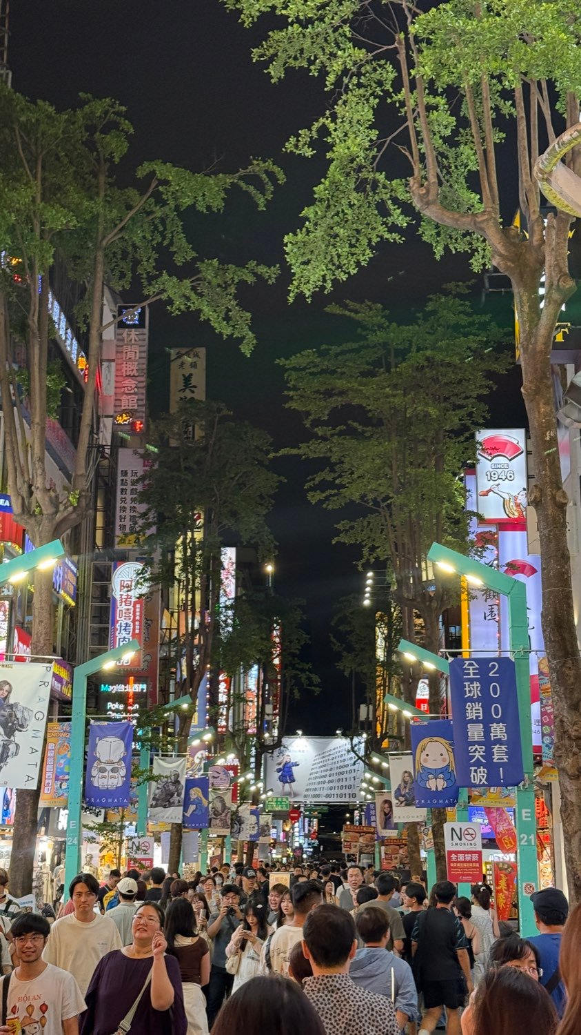 Neon signs and crowds in Ximending, Taipei